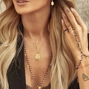 Gold necklace with a charm